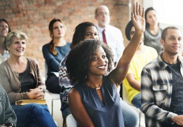 a group of adults in a classroom