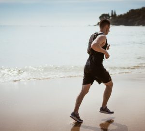 a man running on a beach