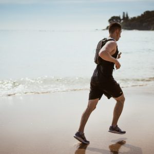 a man running on a beach
