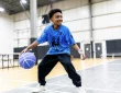 a young boy playing basketball