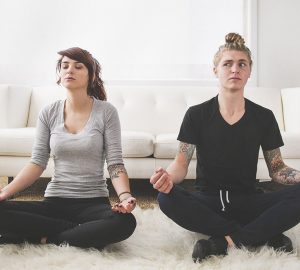 a couple in lotus position relaxing