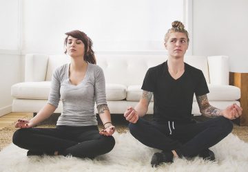 a couple in lotus position relaxing