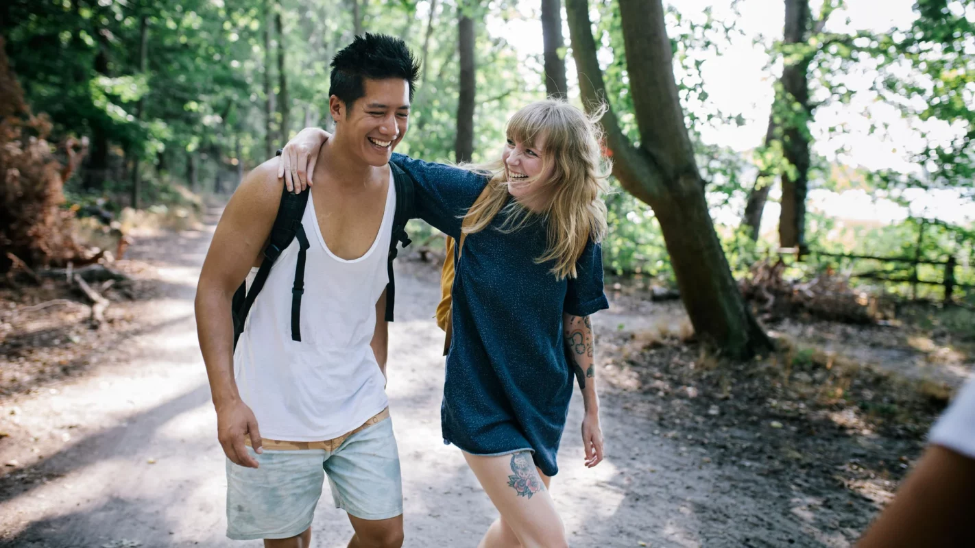 a couple friends hiking outdoors