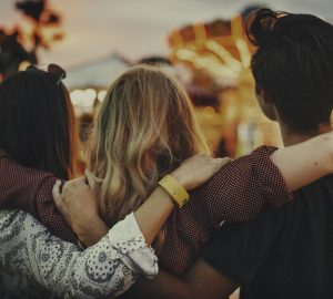 a group of friends with their arms around each other