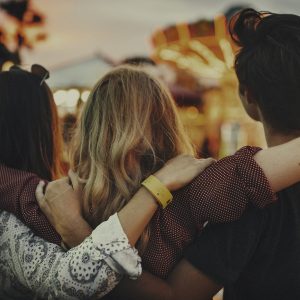 a group of friends with their arms around each other