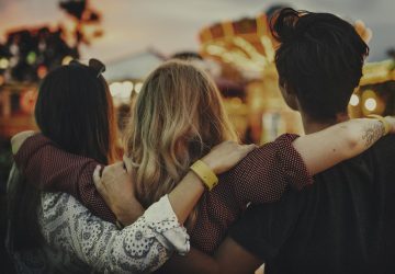 a group of friends with their arms around each other