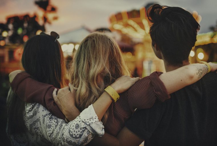 a group of friends with their arms around each other