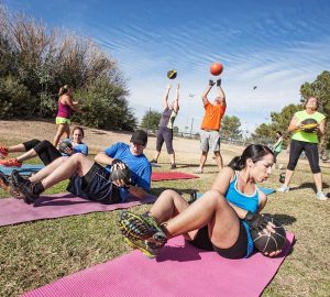a group of people working out outdoors