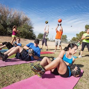 a group of people working out outdoors