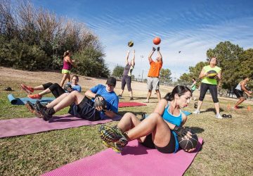 a group of people working out outdoors