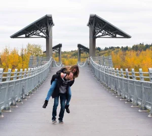 a couple walking in the river valley