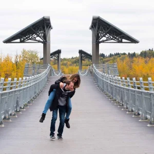 a couple walking in the river valley