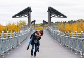 a couple walking in the river valley