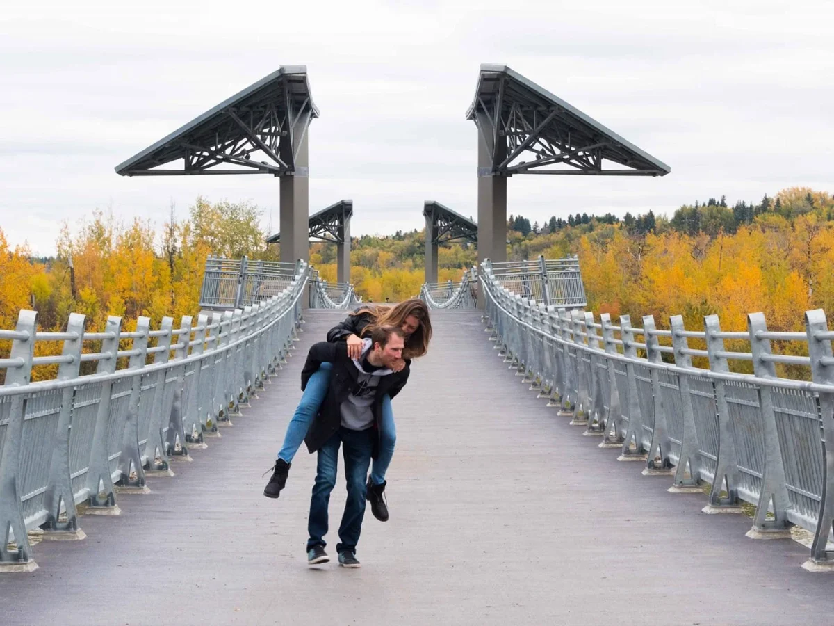 a couple walking in the river valley