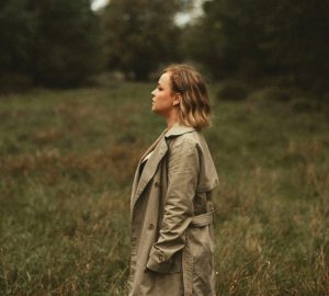 a woman standing in a field