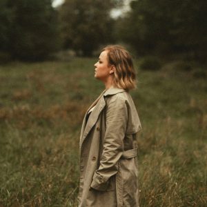 a woman standing in a field