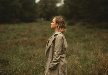 a woman standing in a field