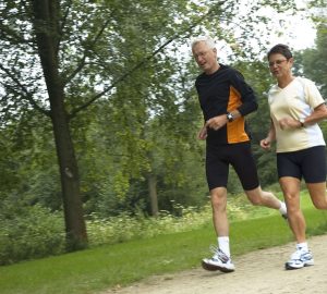a couple running outdoors