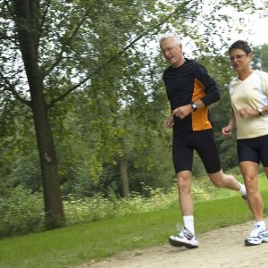 a couple running outdoors