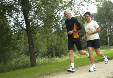 a couple running outdoors