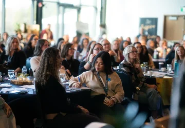 a group of women in a conference