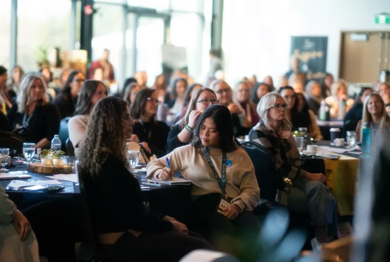 a group of women in a conference