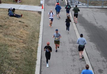 a group running outdoors in the fall