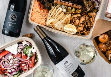 an assortment of takeout containers with wine bottles