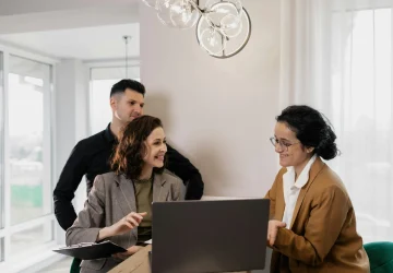 a family sitting with a counsellor