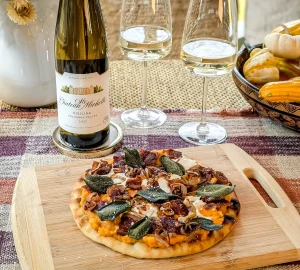 a riesling next to some fall food dishes