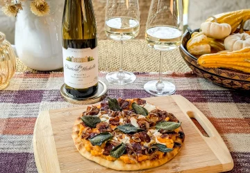 a riesling next to some fall food dishes