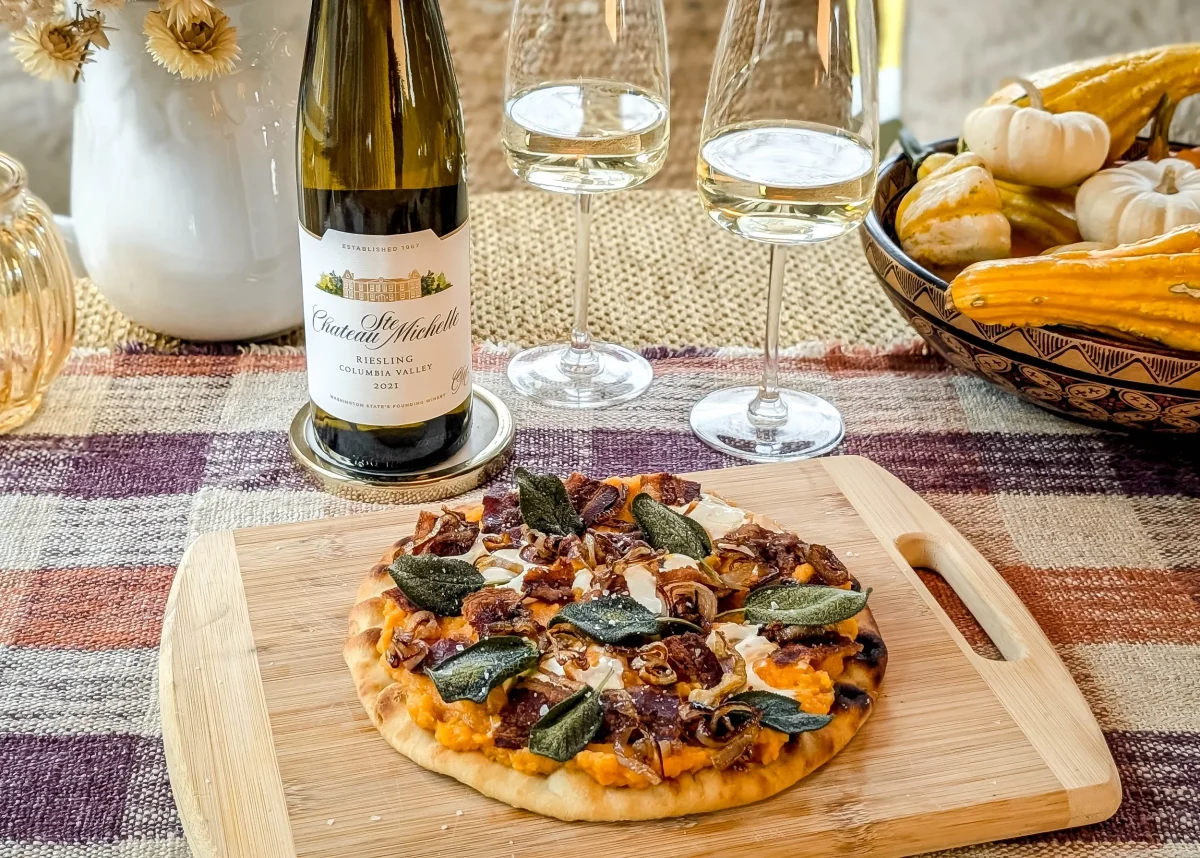 a riesling next to some fall food dishes